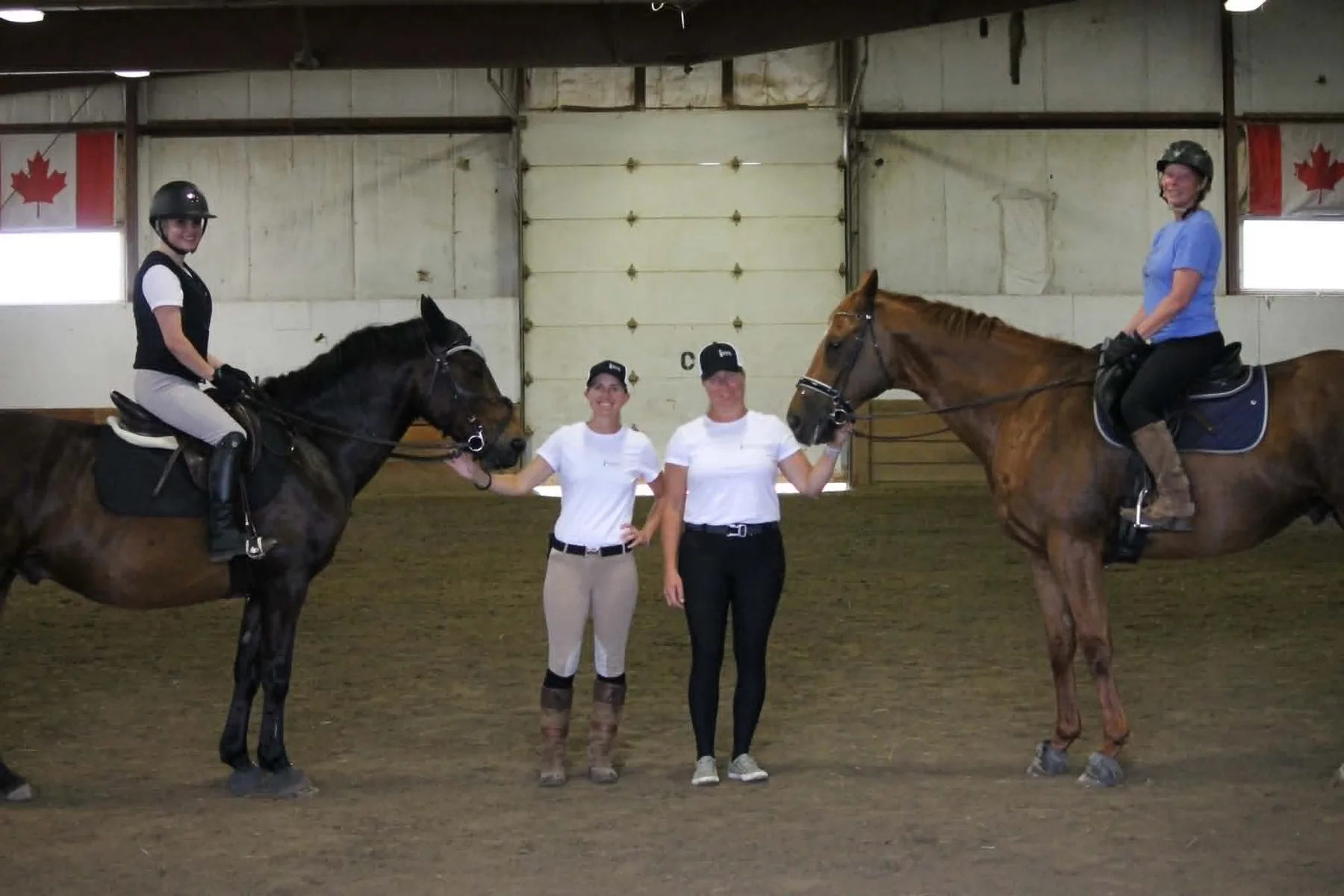 Riders and EFE team members together in the arena